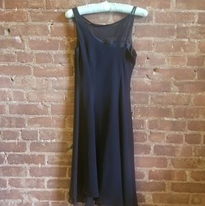 Black cocktail dress with sheer neckline
